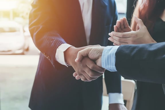 two people shaking hands