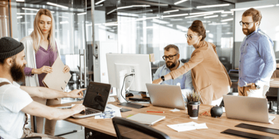 five people working in the office